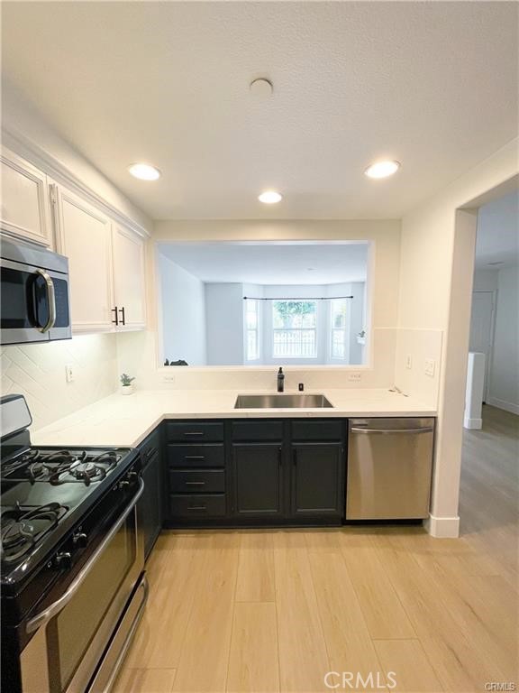 30 Three Vines Court Ladera Ranch, CA 92694 - Photo 12 of 36 a large kitchen with stainless steel appliances granite countertop a stove and a sink