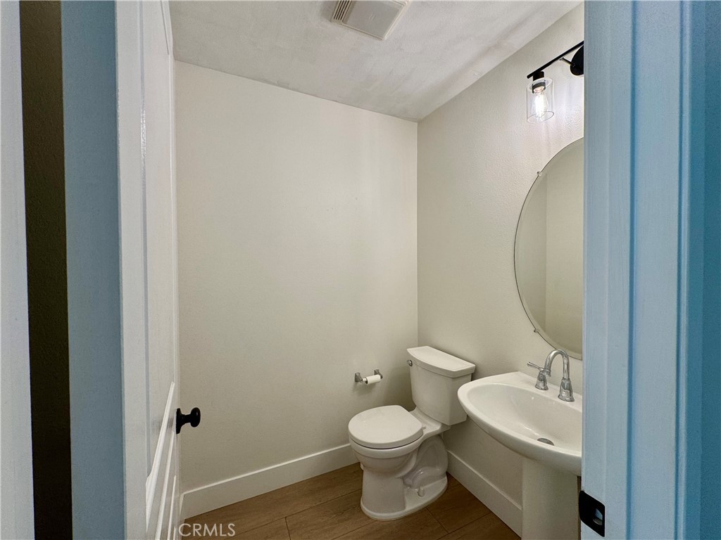 30 Three Vines Court Ladera Ranch, CA 92694 - Photo 13 of 36 a bathroom with a toilet sink and mirror