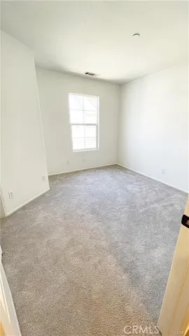 a view of a house with a tree and plants