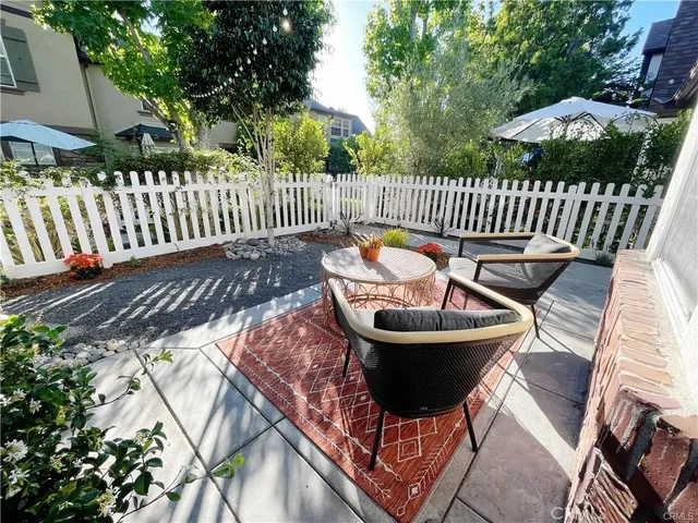 a view of a chairs and table in the patio