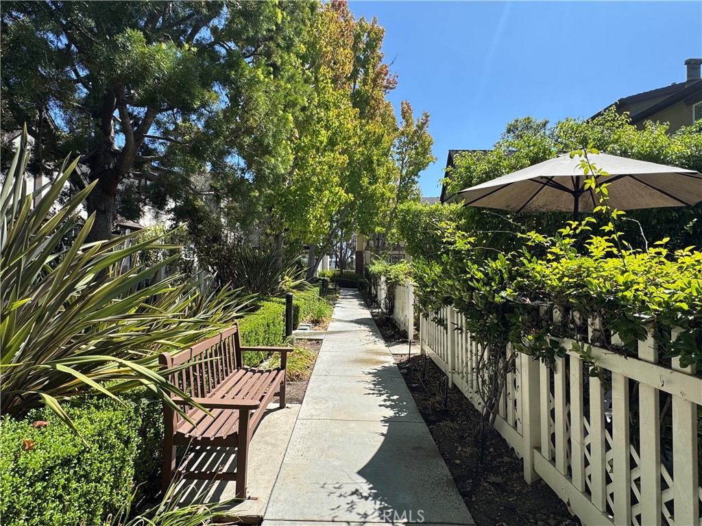 30 Three Vines Court Ladera Ranch, CA 92694 - Photo 5 of 36 a view of a pathway with a flower garden