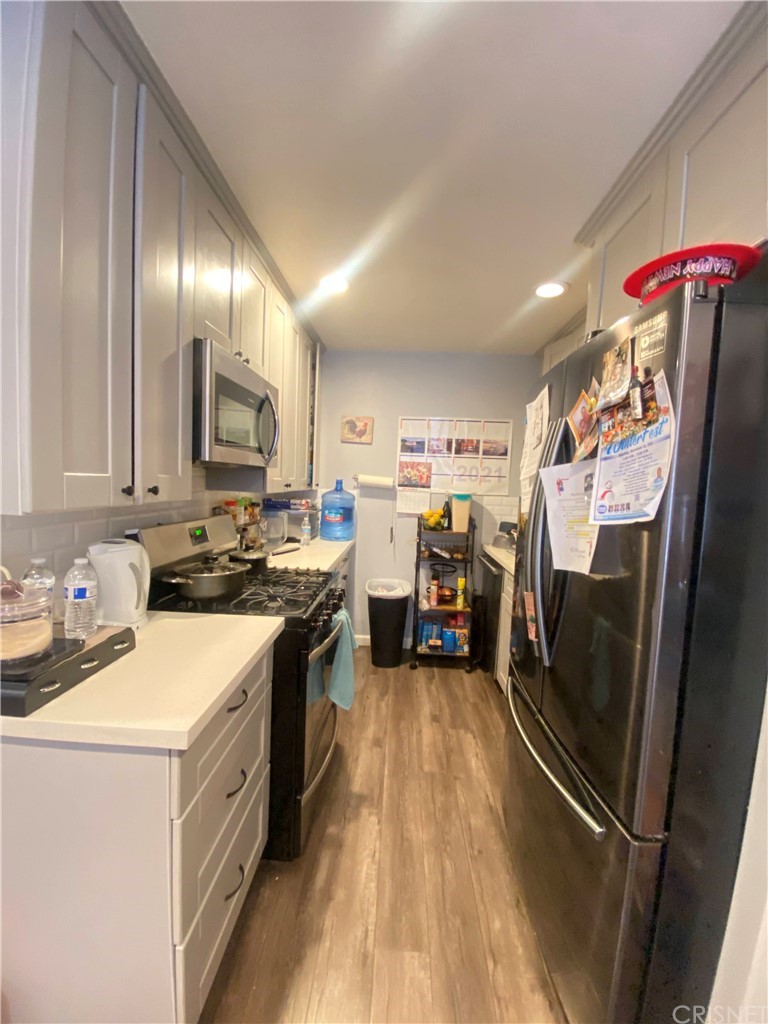 9 Ocotillo Lane Carson, CA 90745 - Photo 12 of 19 a kitchen with lots of counter top space and appliances