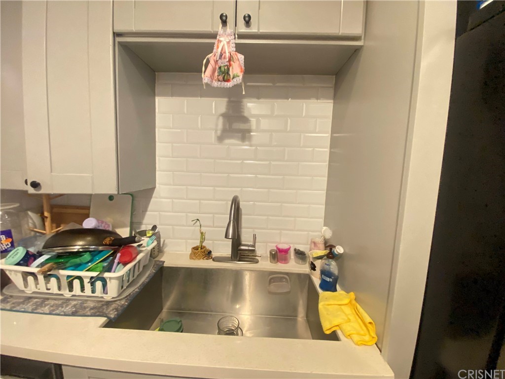 9 Ocotillo Lane Carson, CA 90745 - Photo 13 of 19 a kitchen with a sink and a stove top oven