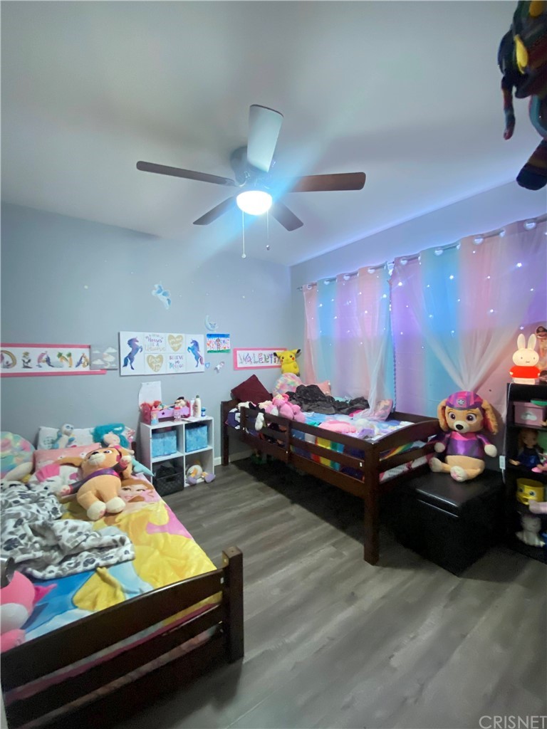 9 Ocotillo Lane Carson, CA 90745 - Photo 7 of 19 a bedroom with furniture and a chandelier