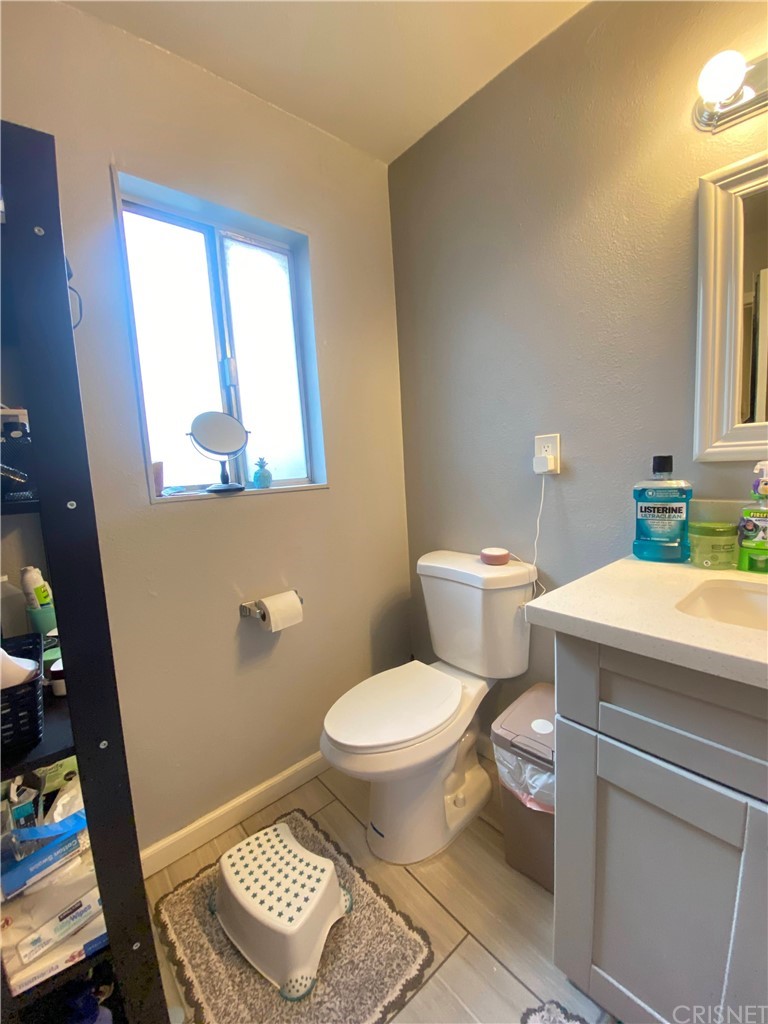 9 Ocotillo Lane Carson, CA 90745 - Photo 9 of 19 a bathroom with a toilet a sink and a window