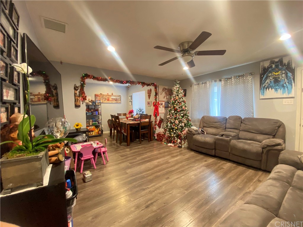 9 Ocotillo Lane Carson, CA 90745 - Photo 10 of 19 a living room with furniture and a chandelier