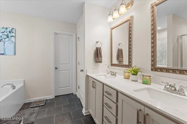 a bathroom with a double vanity sink mirror and double
