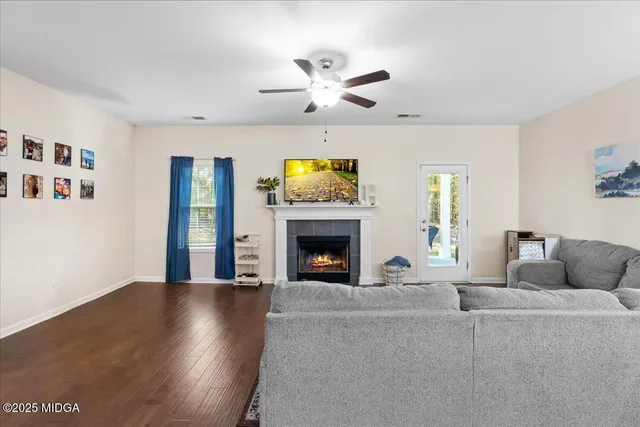a living room with furniture and a fireplace