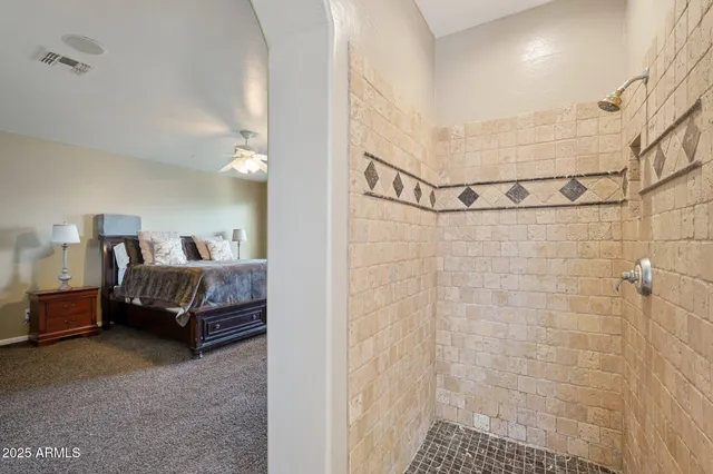 a bedroom with a bed dresser and a window