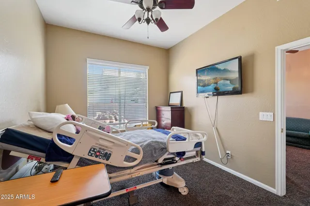 a backyard of a house with fire pit and chairs