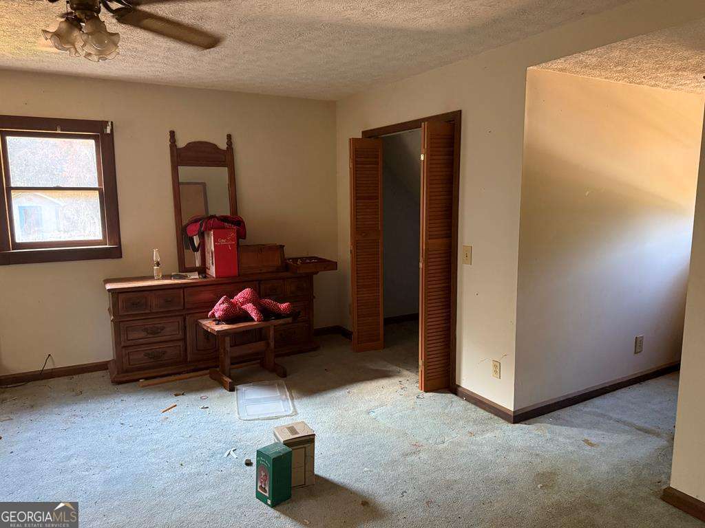 1129 County Road 533 533, AL 36280 - Photo 14 of 19 a living room with furniture and a window