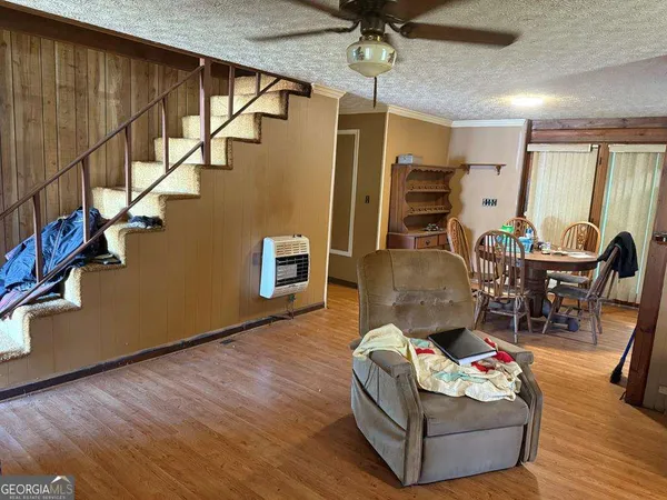 a living room with furniture oven and a table