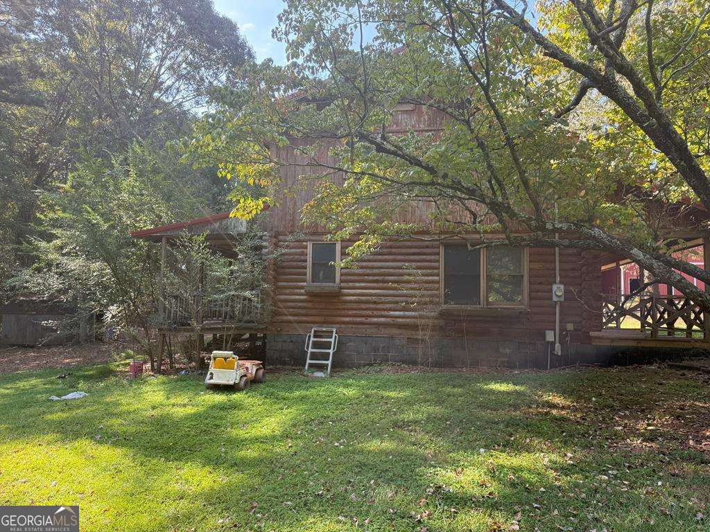 1129 County Road 533 533, AL 36280 - Photo 4 of 19 a view of a house with a backyard