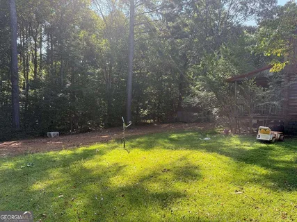 a view of swimming pool in a yard