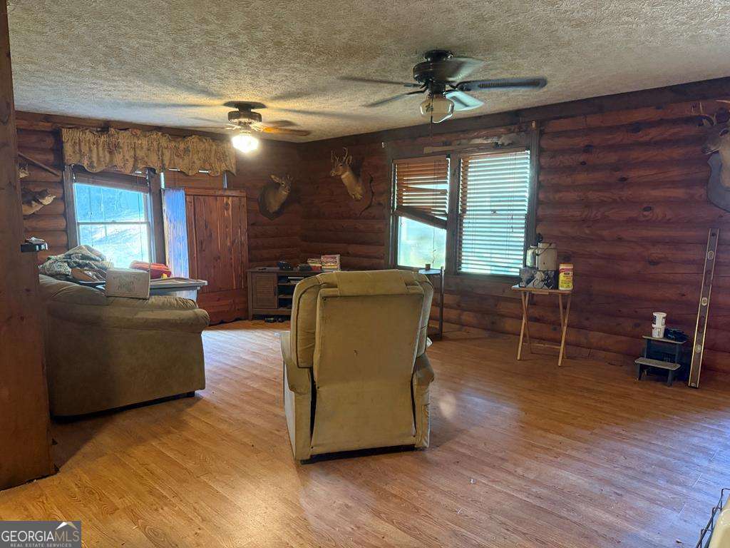 1129 County Road 533 533, AL 36280 - Photo 8 of 19 a living room with furniture and a wooden floor