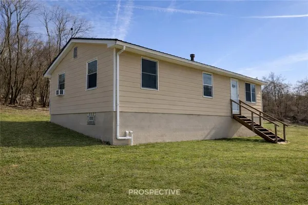 a front view of house with yard