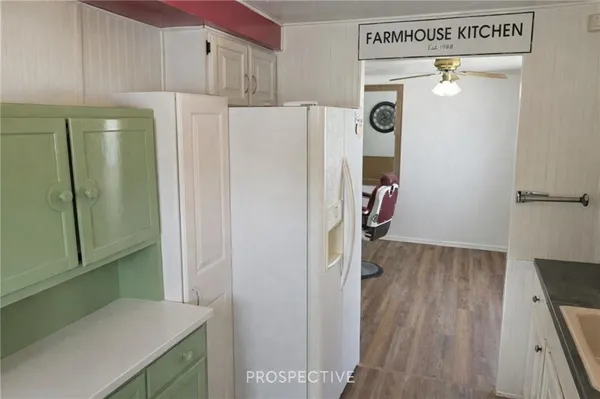 a utility room with cabinets washer and dryer