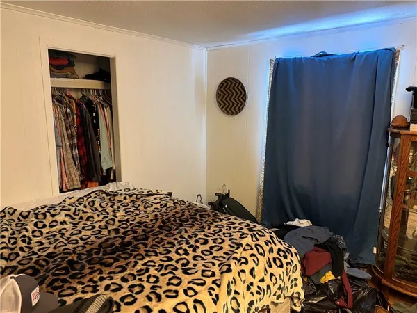 a bedroom with a bed and cabinets