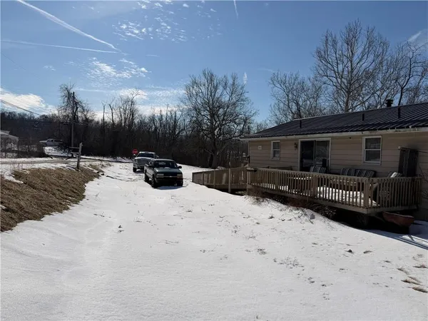 a view of a backyard of the house