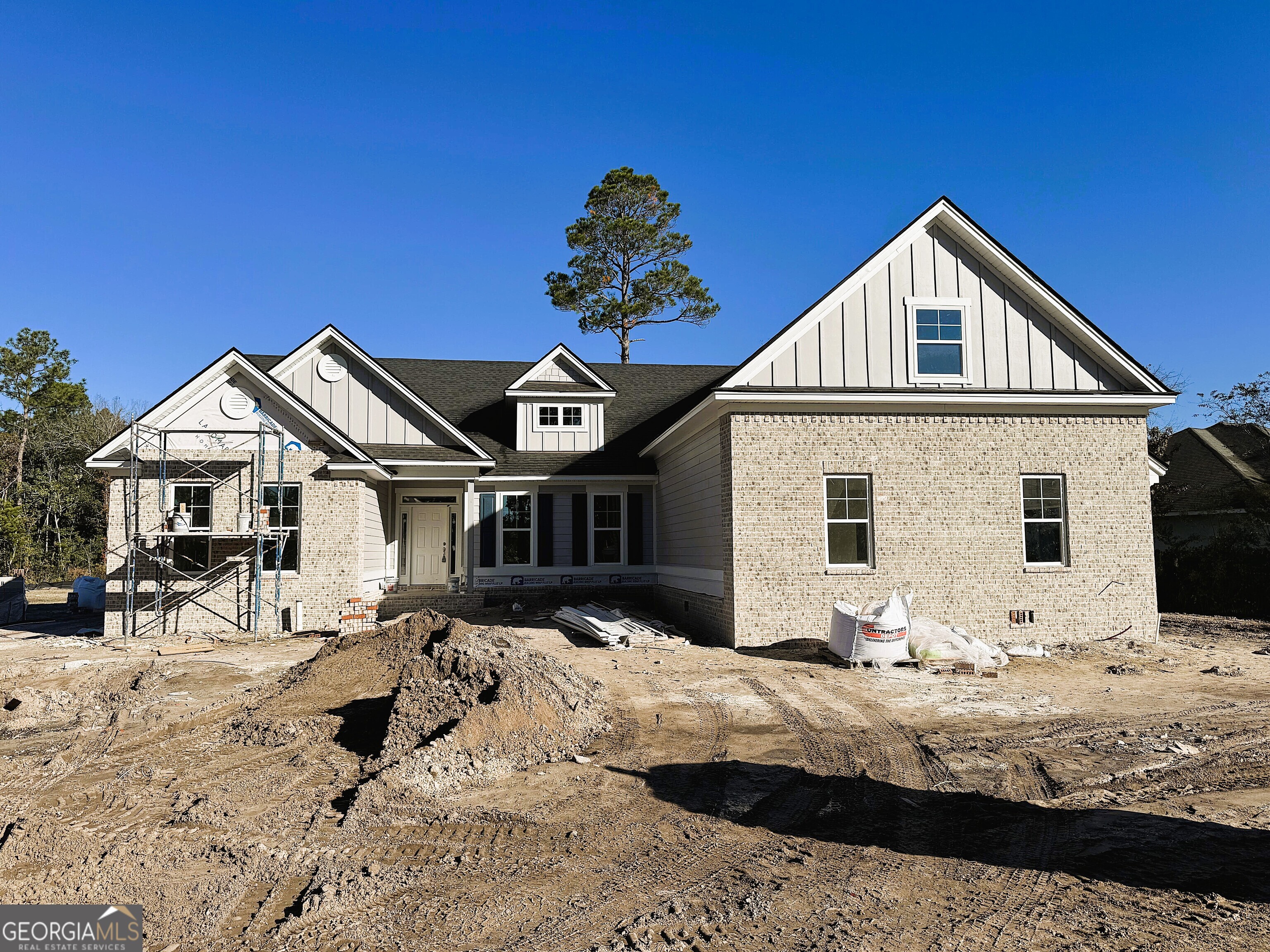 109 Tidal Marsh Way St. Marys, GA 31558 - Photo 1 of 71 a front view of a house with a yard covered in snow