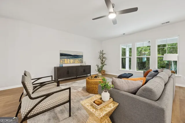 a kitchen with stainless steel appliances granite countertop a sink a stove a microwave and cabinets