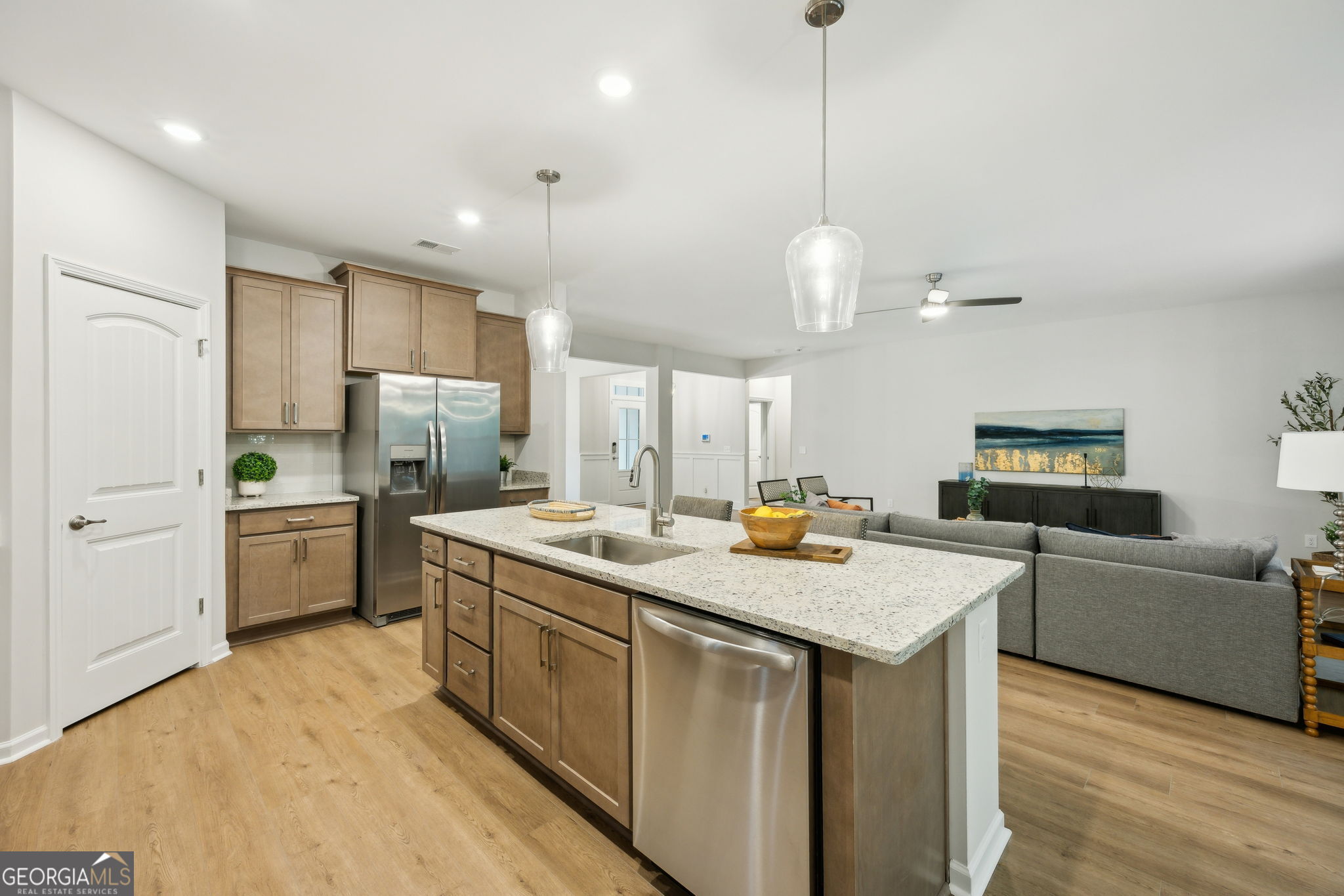 109 Tidal Marsh Way St. Marys, GA 31558 - Photo 18 of 71 a kitchen with stainless steel appliances granite countertop a sink a stove a refrigerator a center island and cabinets