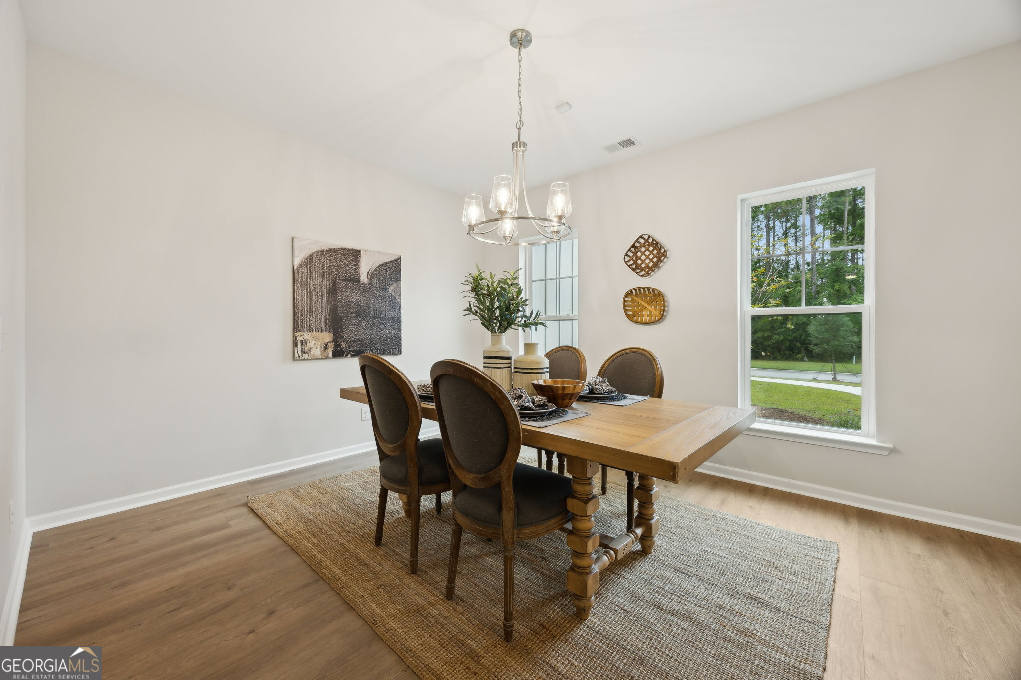 109 Tidal Marsh Way St. Marys, GA 31558 - Photo 22 of 71 a view of a dining room with furniture and chandelier