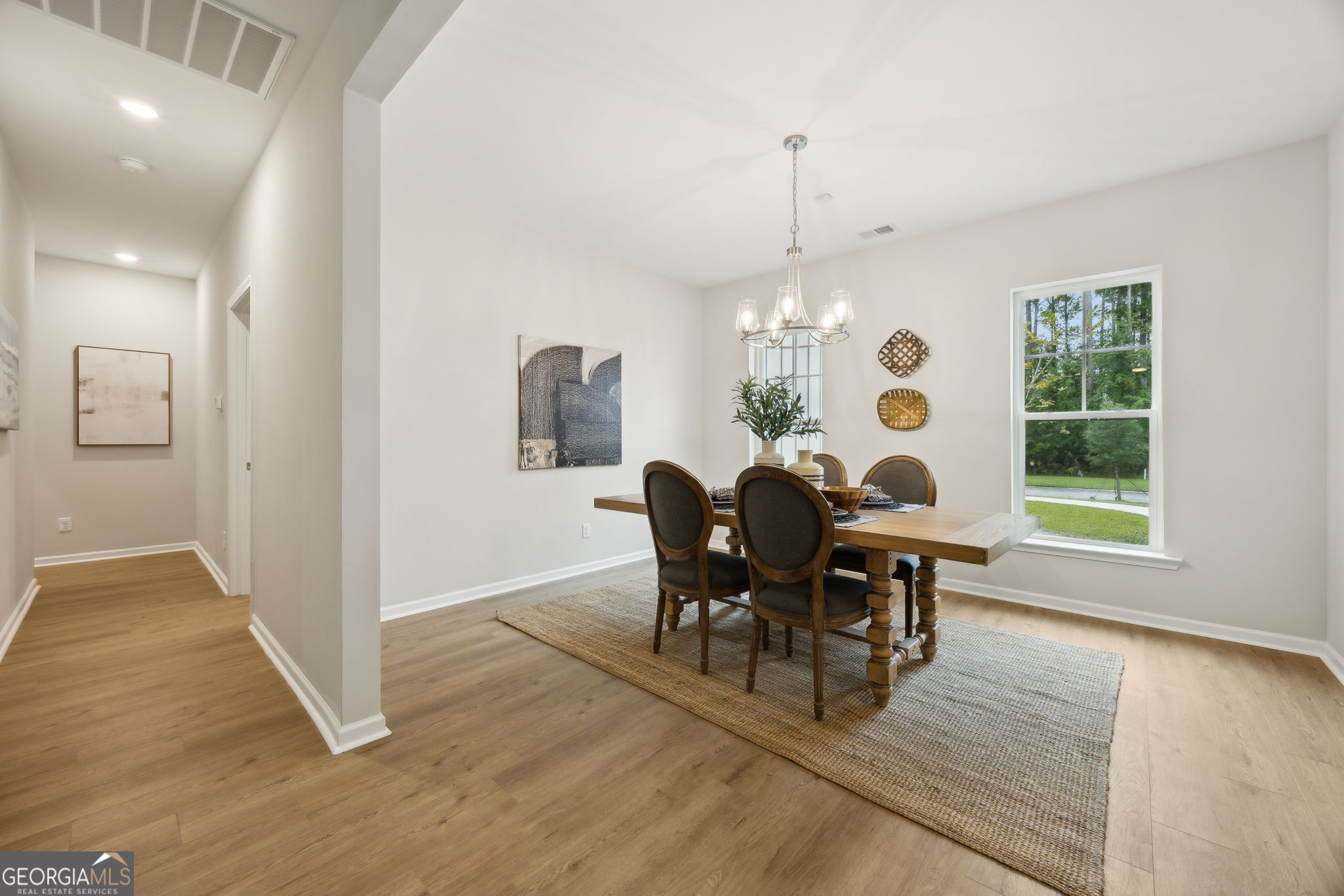 109 Tidal Marsh Way St. Marys, GA 31558 - Photo 23 of 71 a view of a dining room with furniture and chandelier