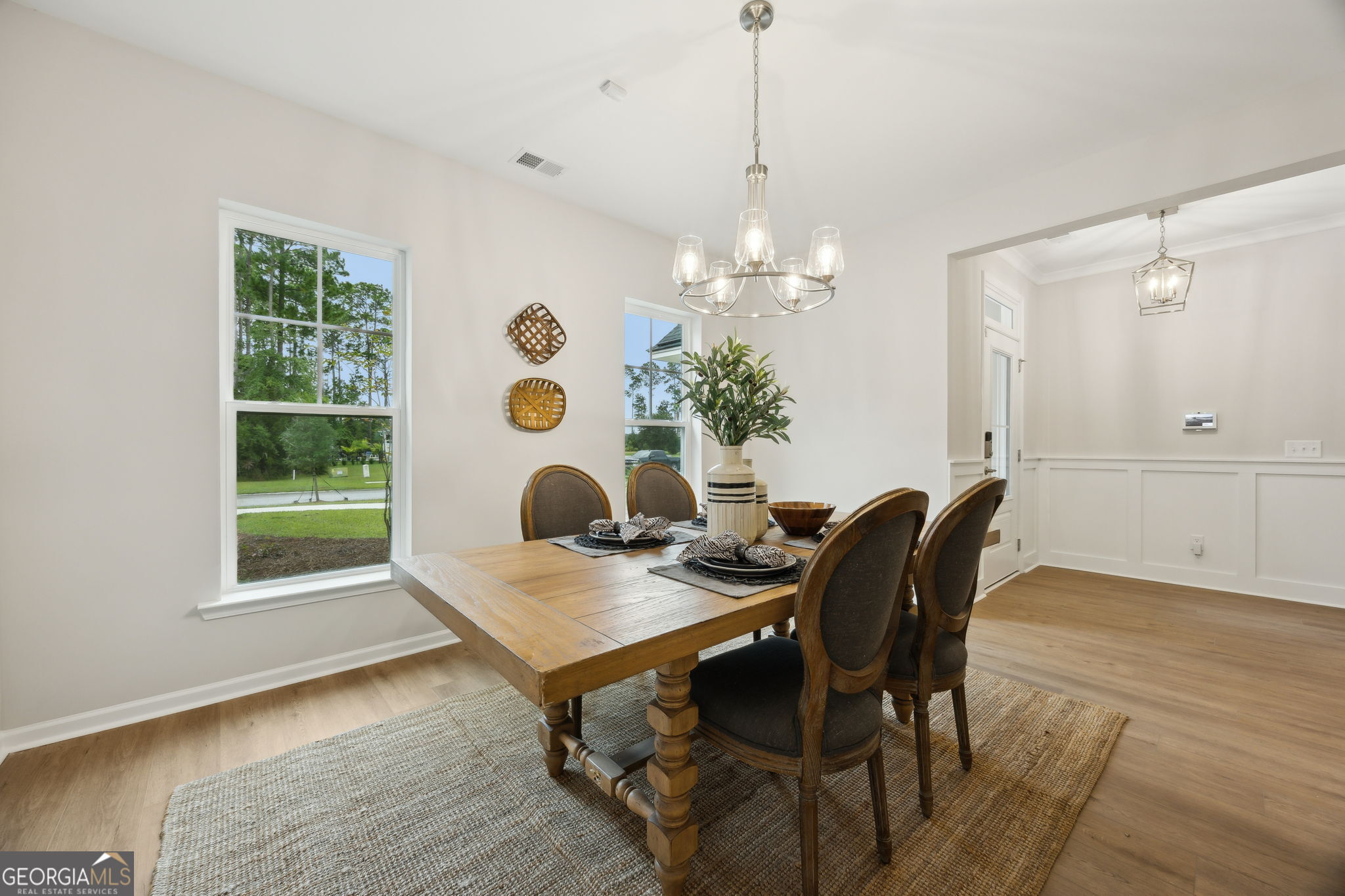 109 Tidal Marsh Way St. Marys, GA 31558 - Photo 24 of 71 a view of a dining room with furniture and chandelier