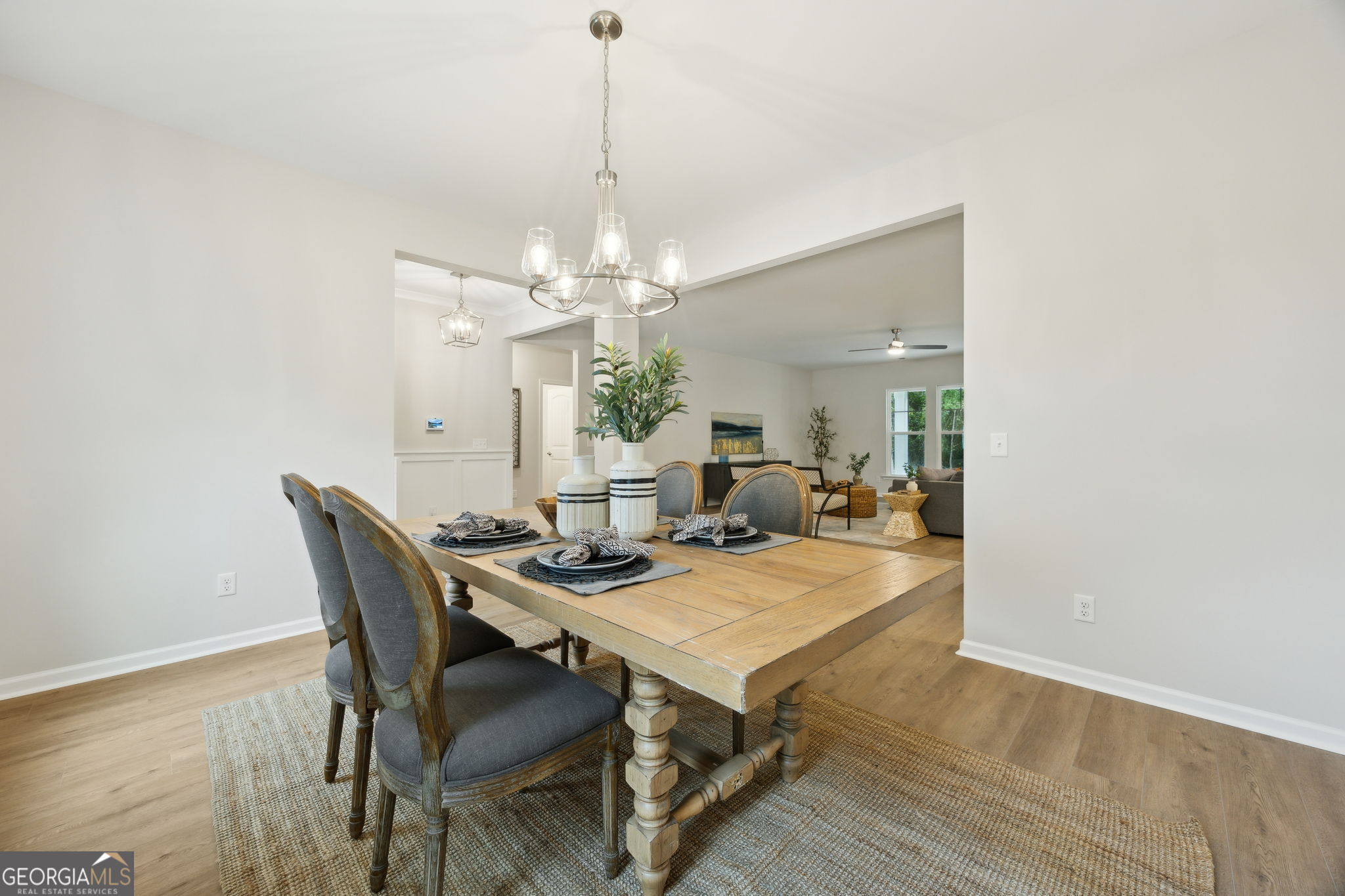 109 Tidal Marsh Way St. Marys, GA 31558 - Photo 25 of 71 a view of a dining room with furniture and wooden floor