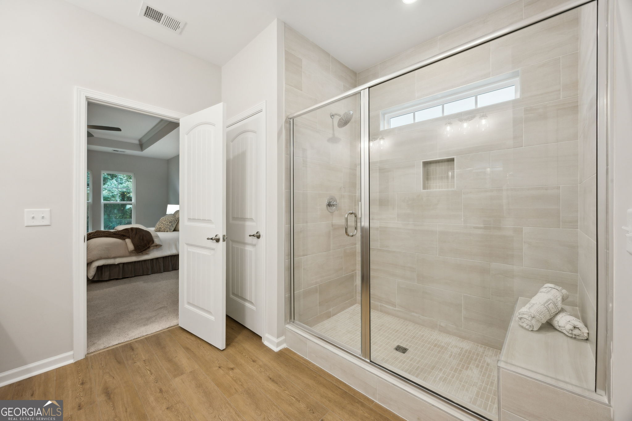 109 Tidal Marsh Way St. Marys, GA 31558 - Photo 32 of 71 a bathroom with a glass shower door