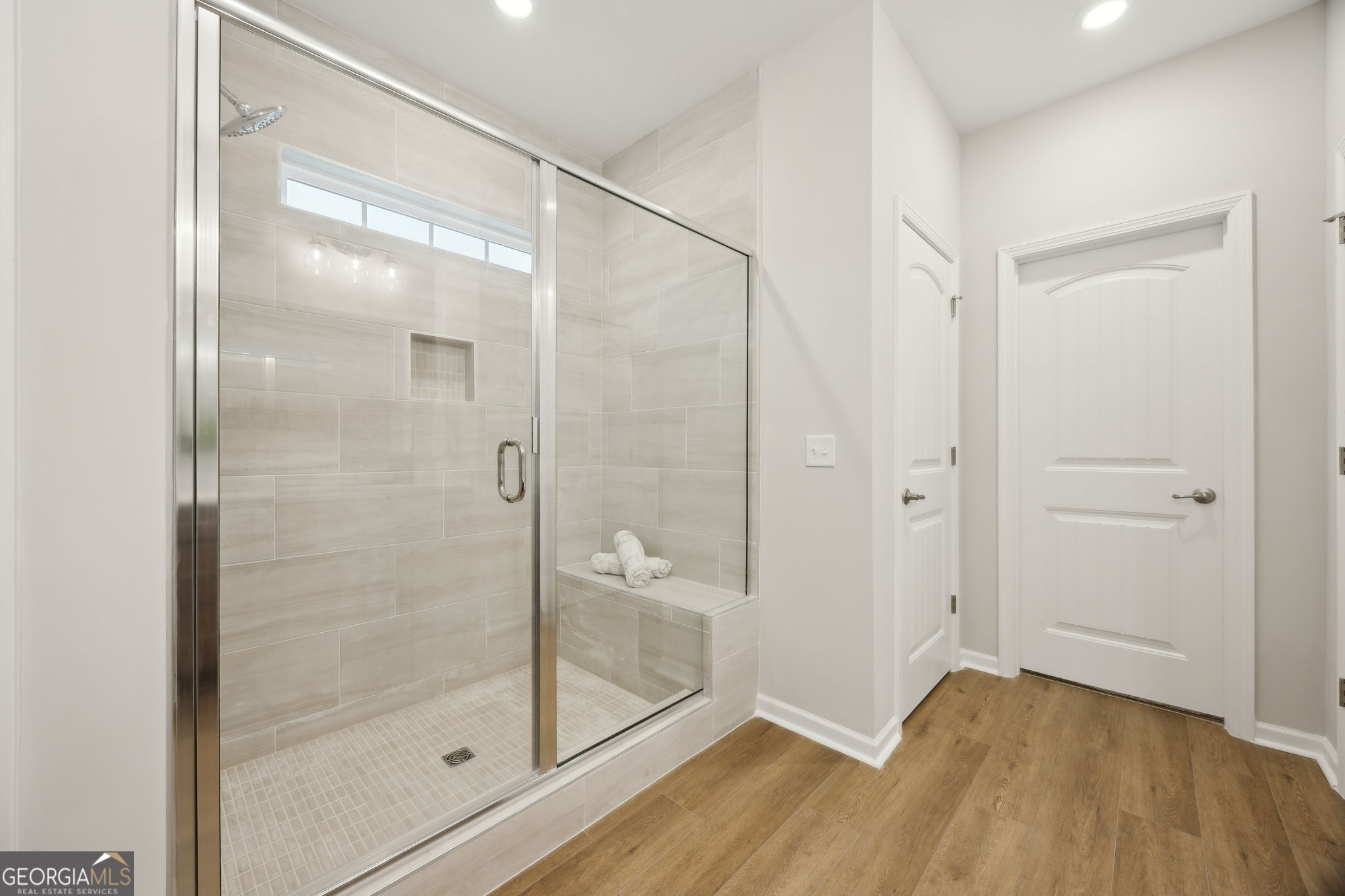 109 Tidal Marsh Way St. Marys, GA 31558 - Photo 33 of 71 a bathroom with a glass shower door