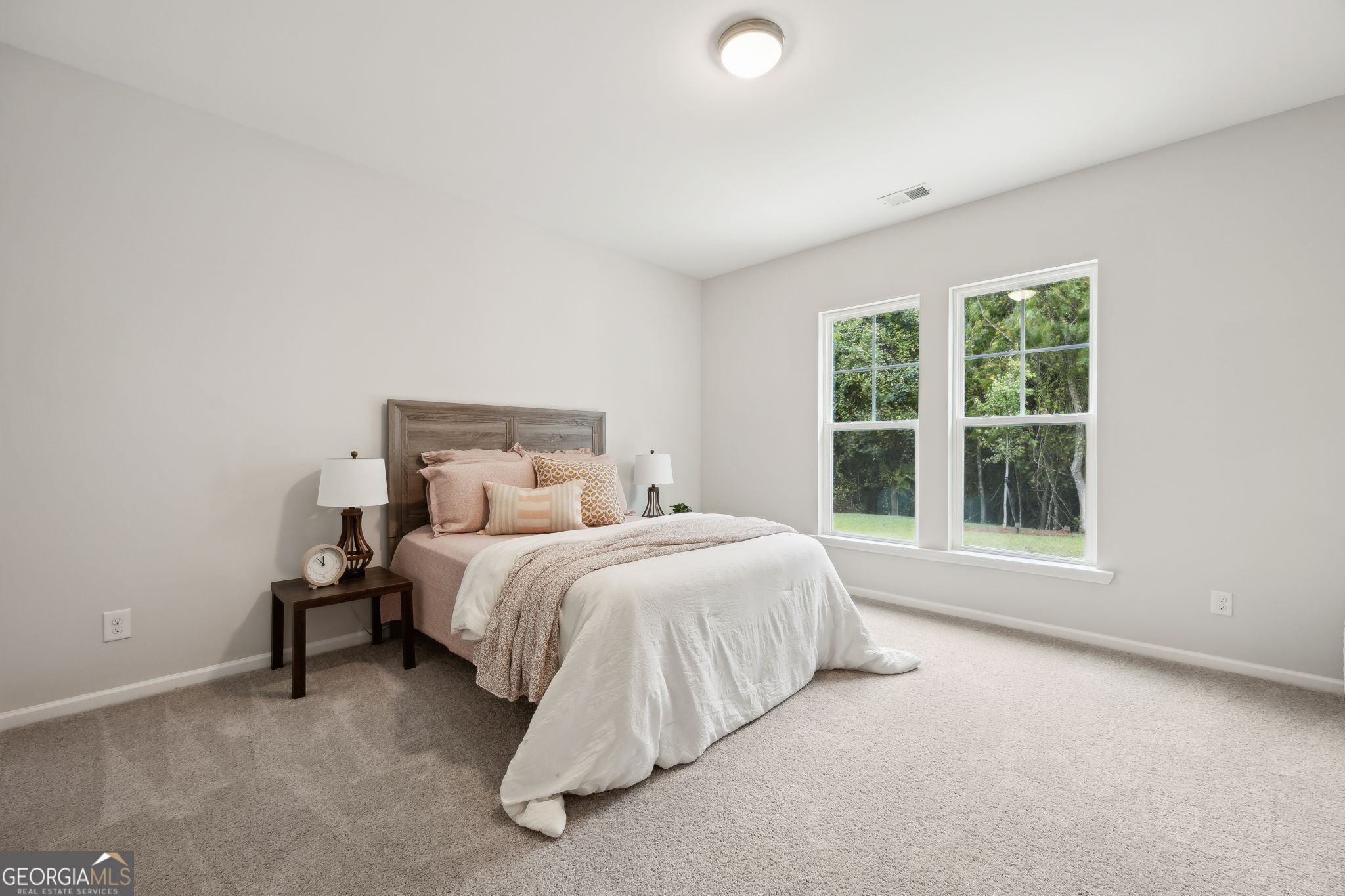 109 Tidal Marsh Way St. Marys, GA 31558 - Photo 36 of 71 a large bed sitting in a bedroom next to a window