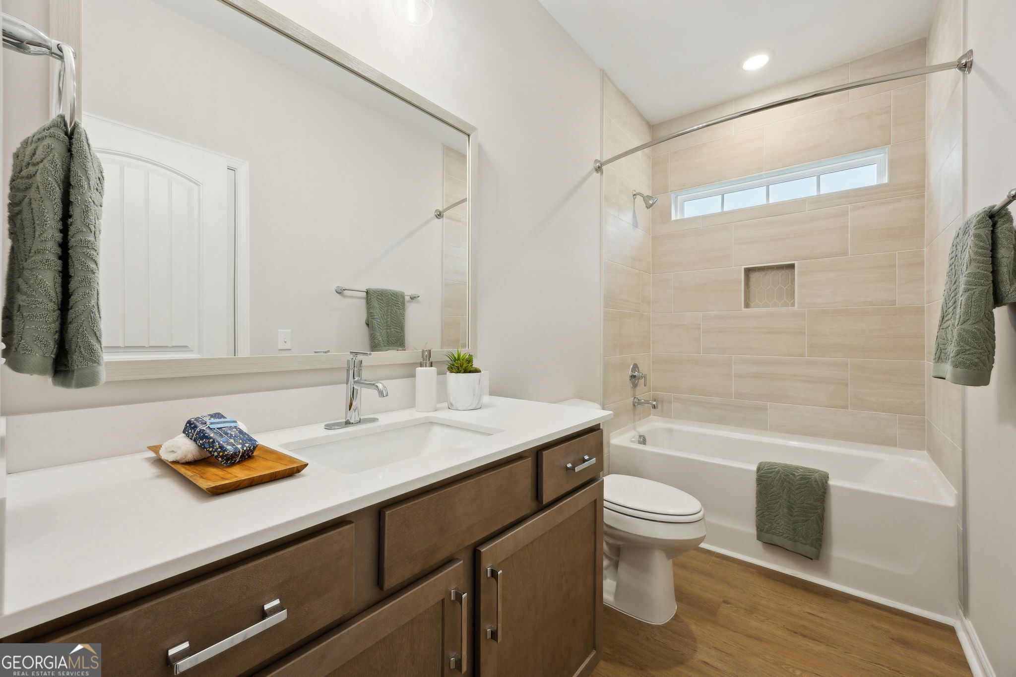 109 Tidal Marsh Way St. Marys, GA 31558 - Photo 38 of 71 a bathroom with a granite countertop sink a toilet and shower