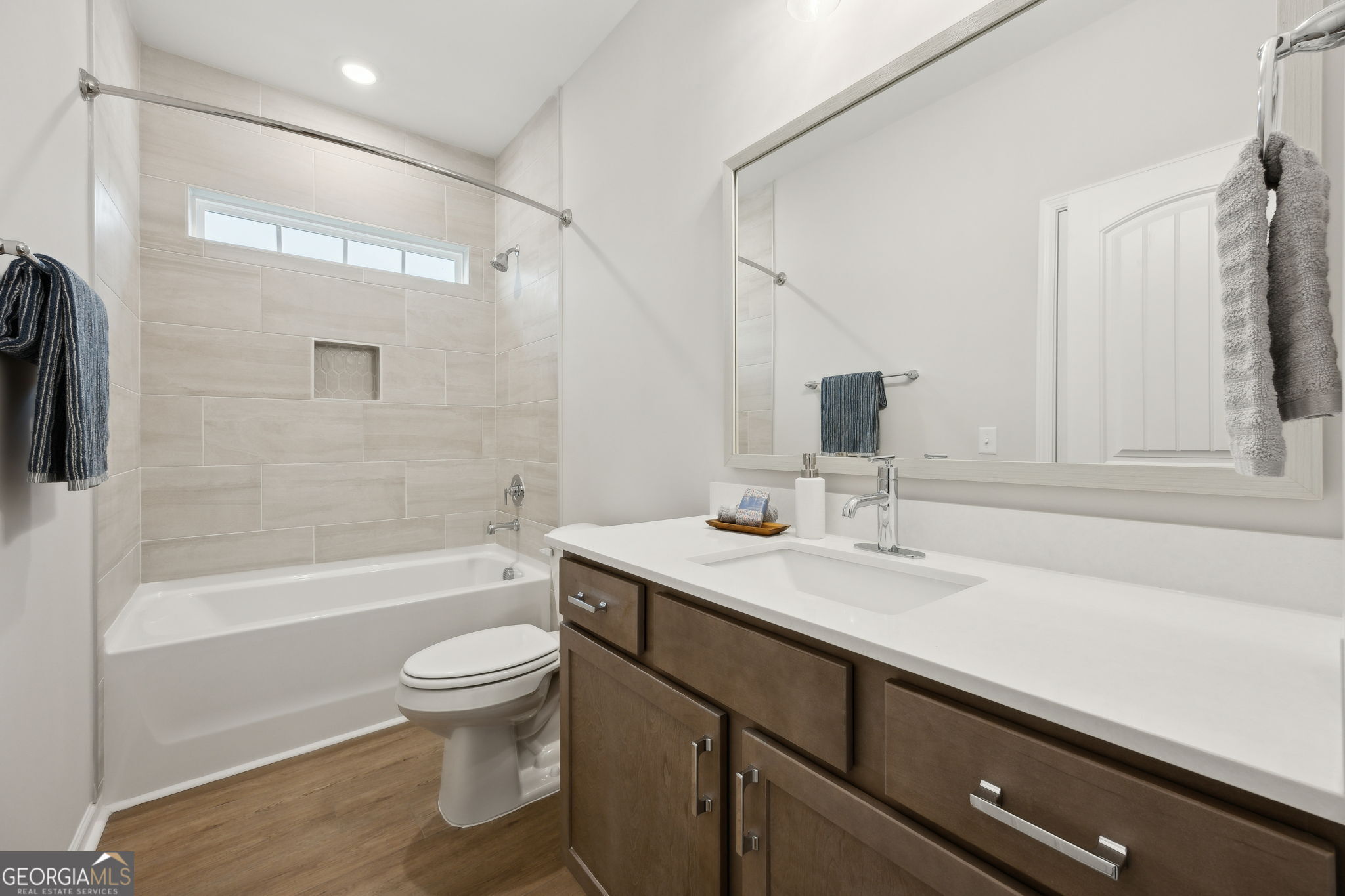 109 Tidal Marsh Way St. Marys, GA 31558 - Photo 42 of 71 a bathroom with a sink a toilet and shower