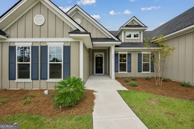 a view of livingroom with furniture wooden floor and windows