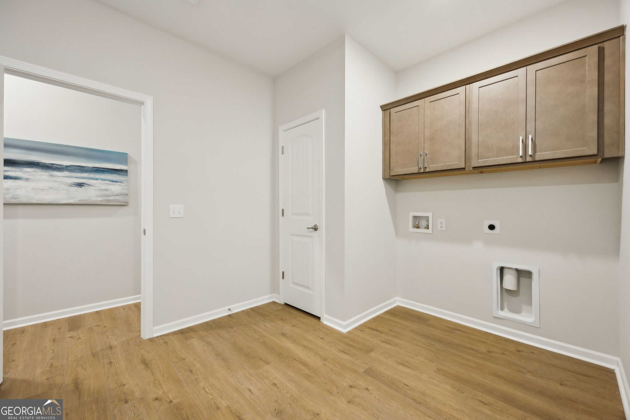 109 Tidal Marsh Way St. Marys, GA 31558 - Photo 51 of 71 a view of an empty room with wooden floor and a window