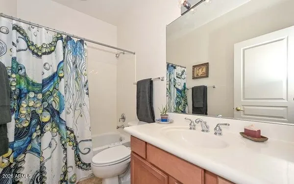 a bathroom with a granite countertop sink mirror and double