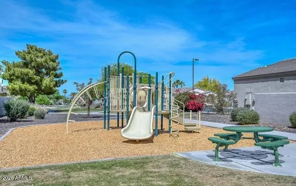 a view of a patio with swimming pool table and chairs