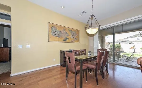 a living room with furniture a fireplace and a large window