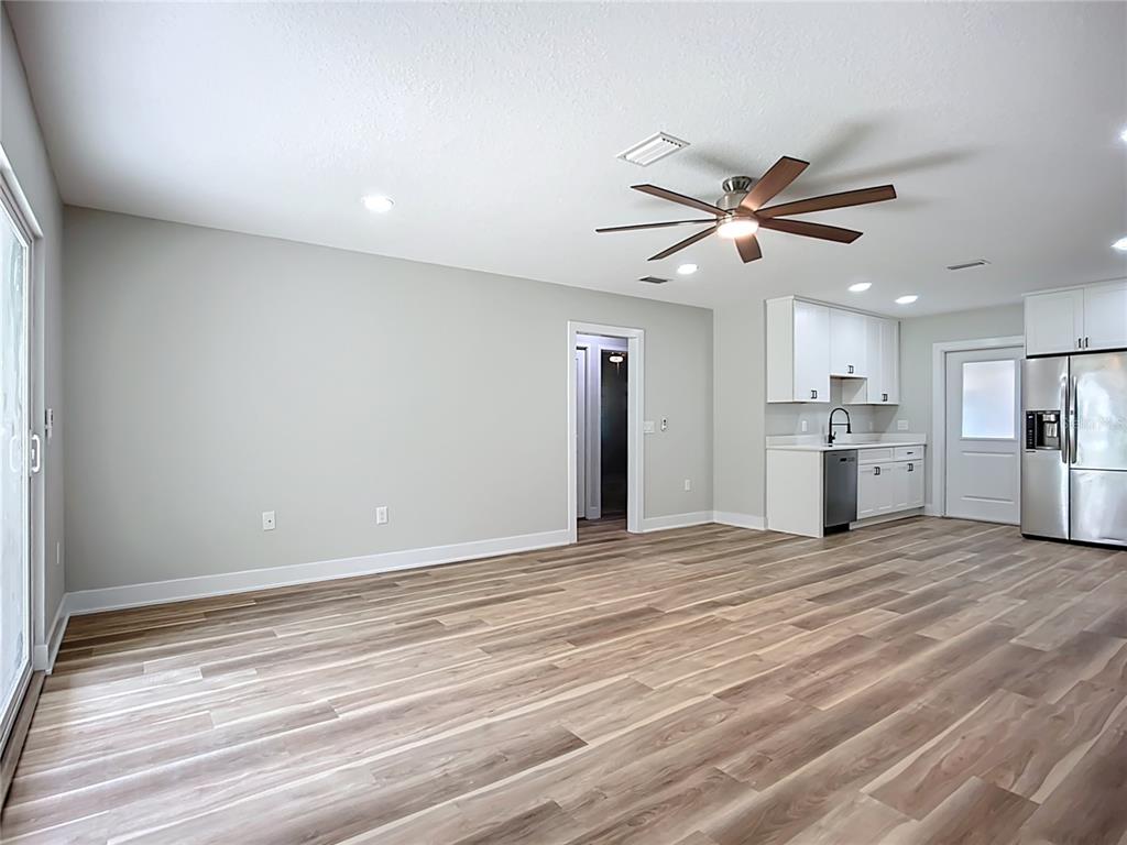 1307 Eagleview Drive Brandon, FL 33510 - Photo 12 of 27 a view of empty room with wooden floor and window