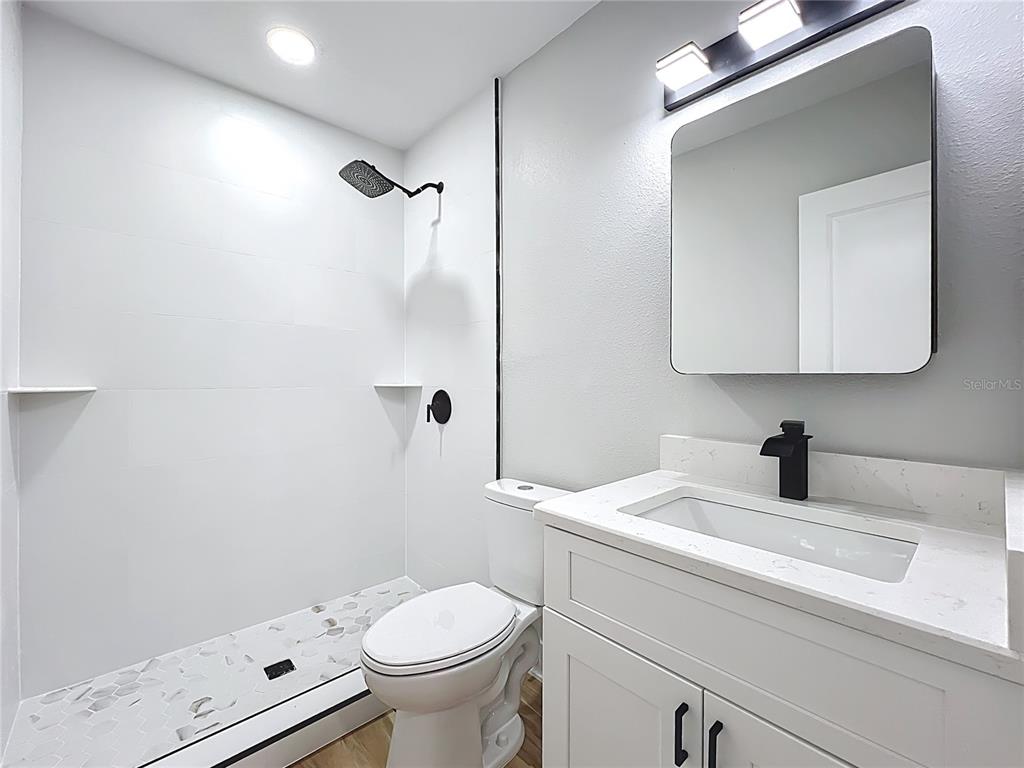 1307 Eagleview Drive Brandon, FL 33510 - Photo 14 of 27 a bathroom with a sink toilet and shower