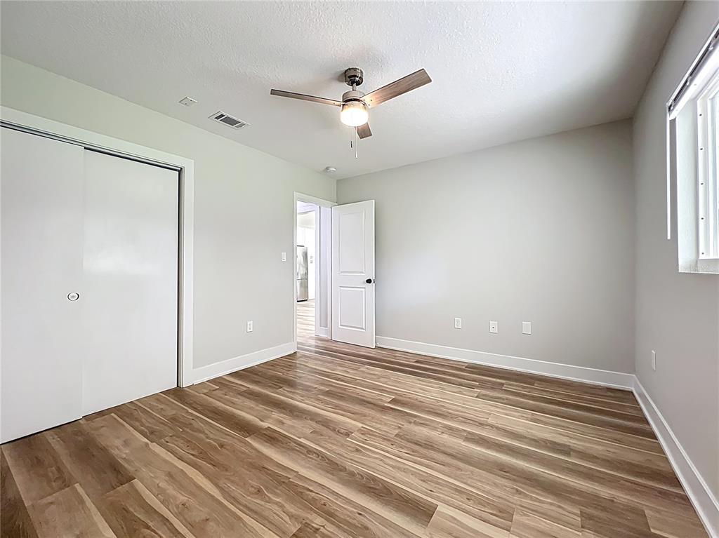 1307 Eagleview Drive Brandon, FL 33510 - Photo 18 of 27 a view of a livingroom with a ceiling fan and window