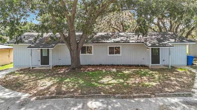 a house with trees in front of it