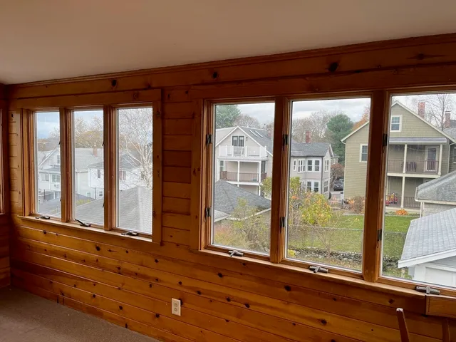 front view of a house with a large window