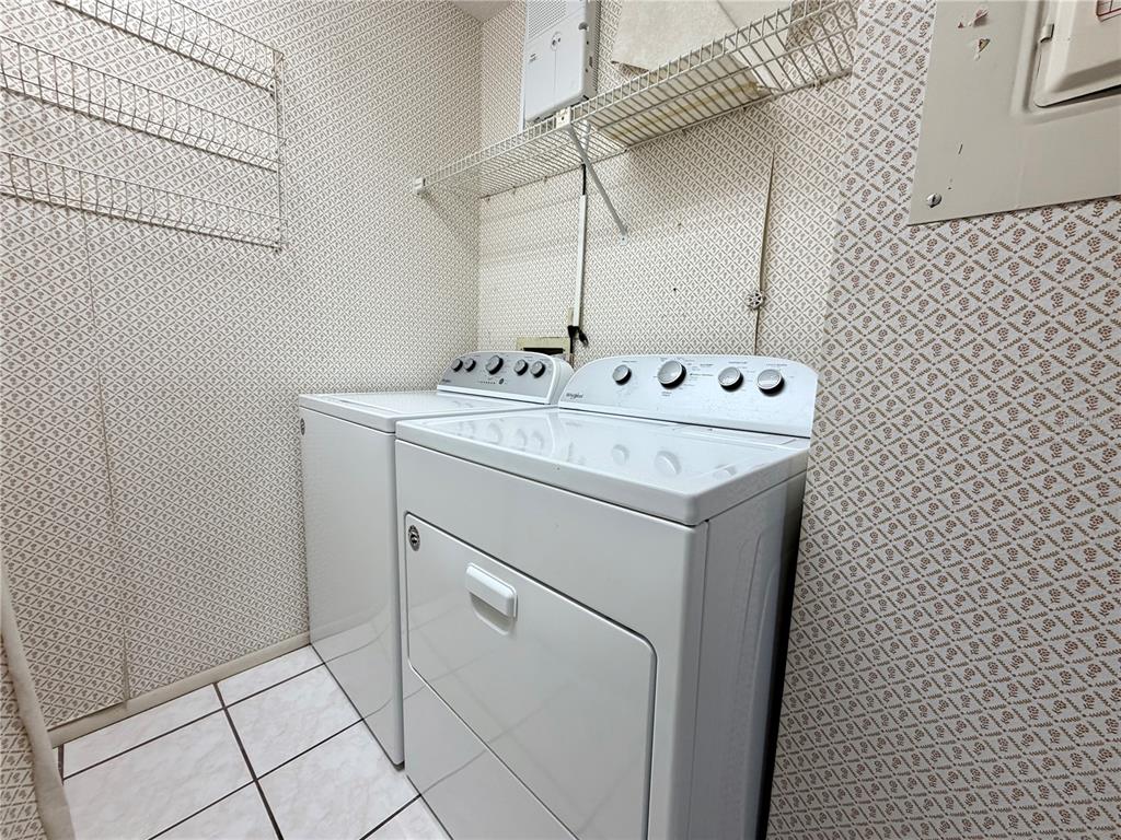 11210 Dollar Lake Drive, Unit 2 Port Richey, FL 34668 - Photo 13 of 15 a utility room with dryer and washer