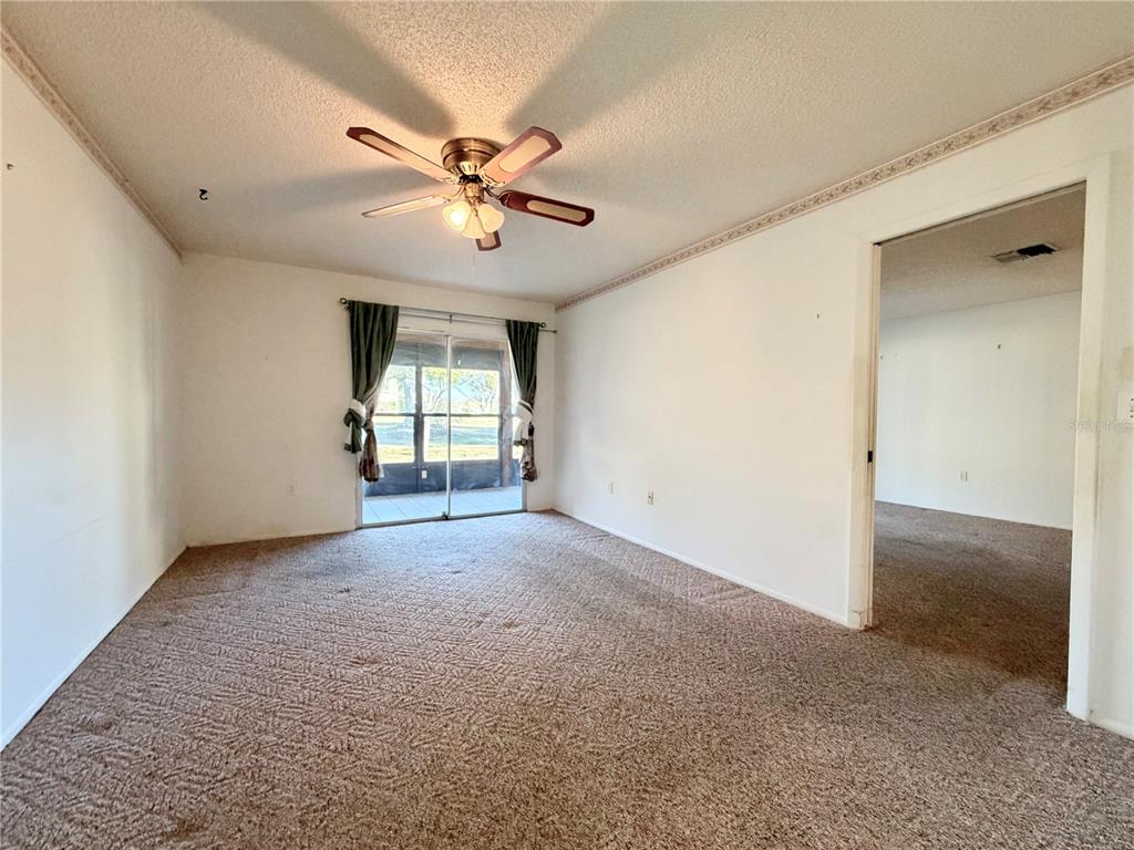 11210 Dollar Lake Drive, Unit 2 Port Richey, FL 34668 - Photo 7 of 15 a view of an empty room with a window