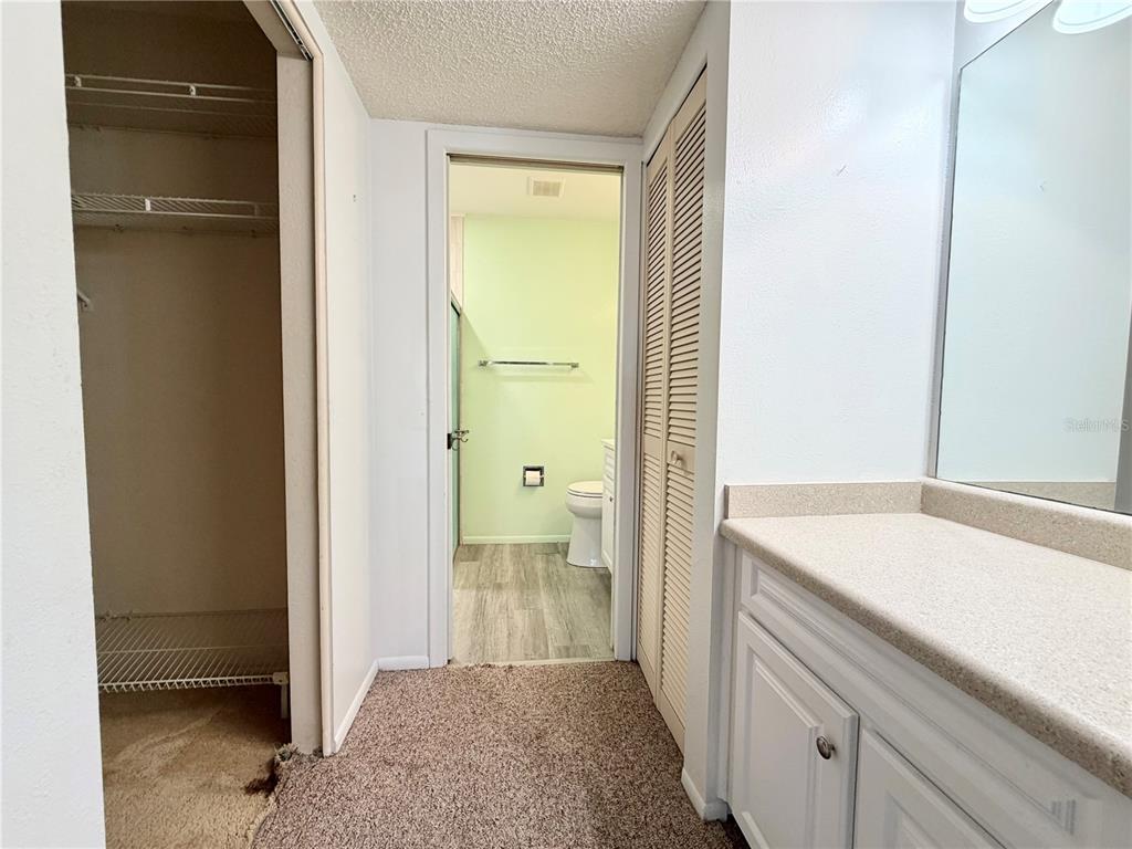 11210 Dollar Lake Drive, Unit 2 Port Richey, FL 34668 - Photo 9 of 15 a bathroom with a sink and a mirror