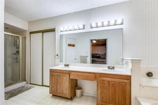 a bathroom with a sink double vanity and a mirror