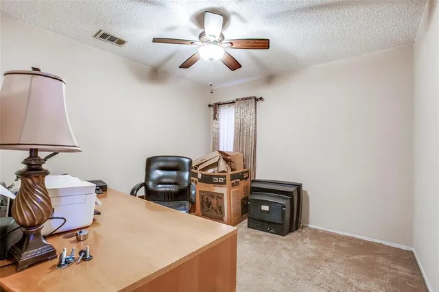 a view of a workspace with furniture